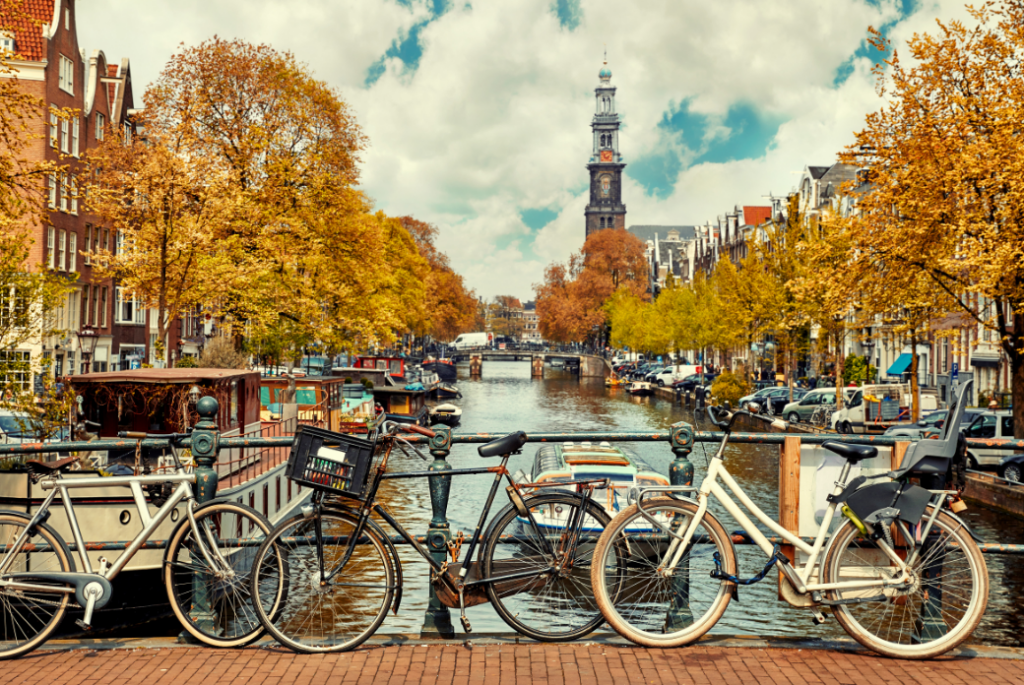 Image of bikes and a railing on an autumn day in Amsterdam