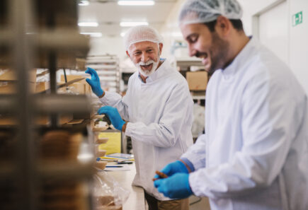 two workers in the food sector