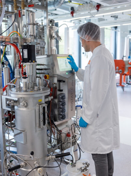 VTT Espoo facility, man working with fermentor to produce protein ingredients using biomass fermentation