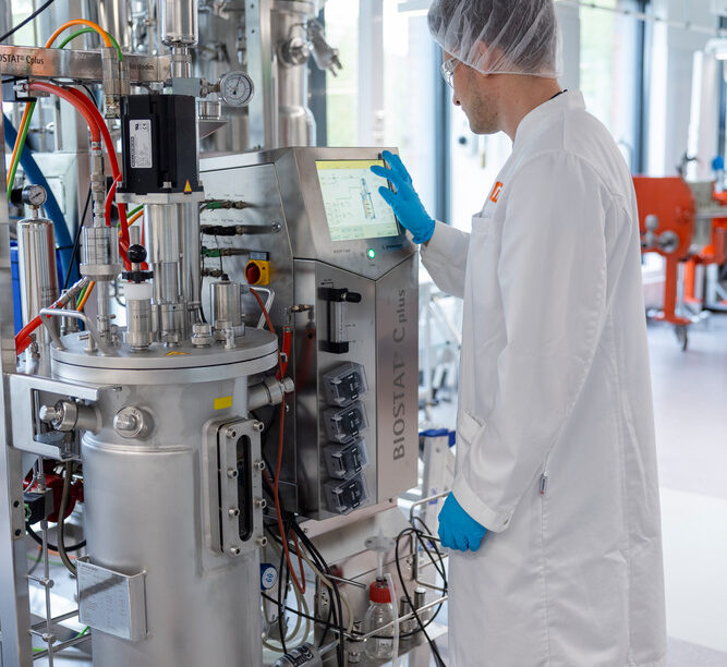 VTT Espoo facility, man working with fermentor to produce protein ingredients using biomass fermentation